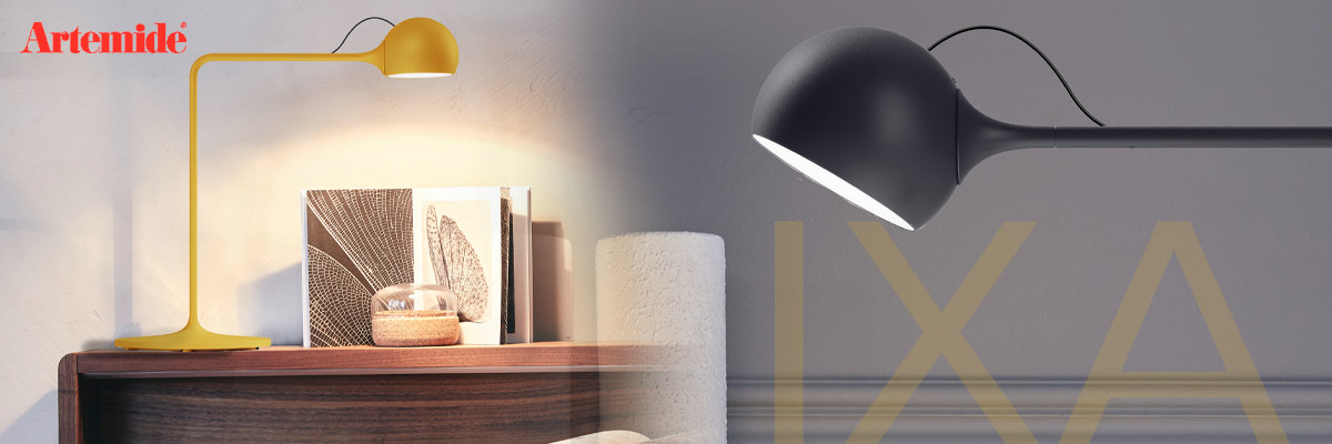 Artemide IXA LED table lamp in yellow and black in a cozy reading corner