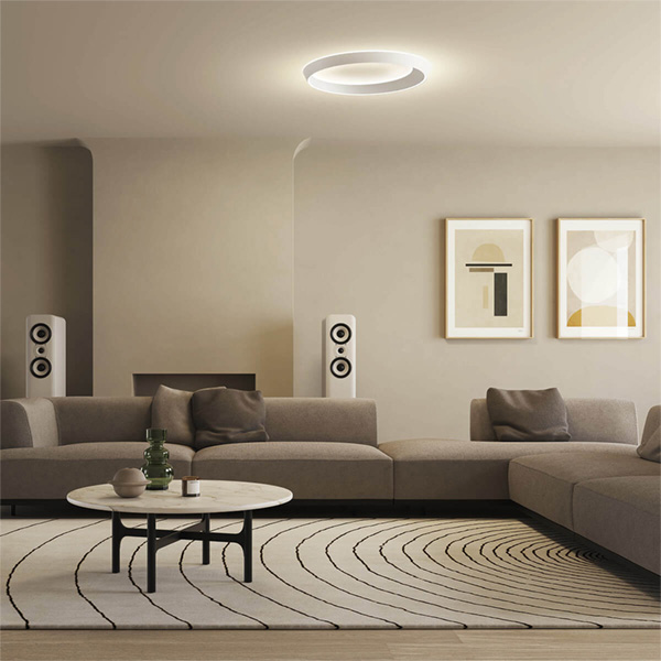 Round LED ceiling light with direct and indirect illumination – creating a modern and warm living room ambience