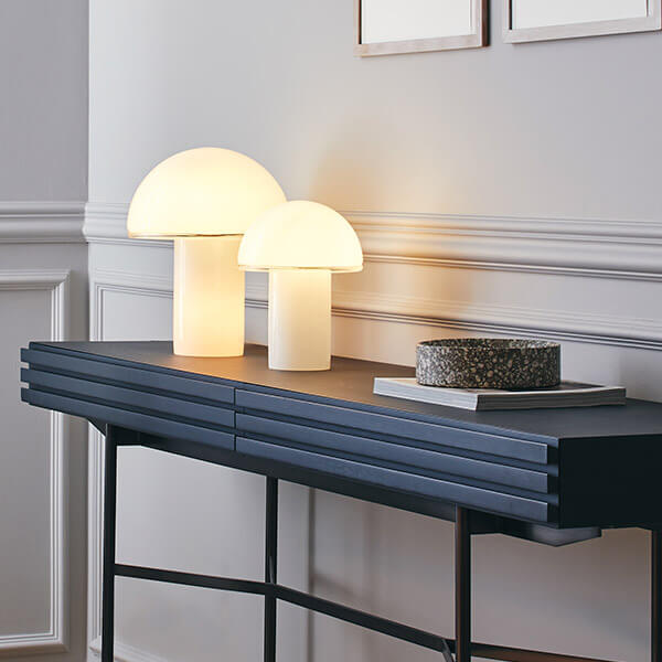 Artemide Onfale table lamps: organic glass mushroom lamps on a console in the living room