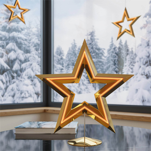 LED Christmas star lights on a windowsill with snowy landscape in the background